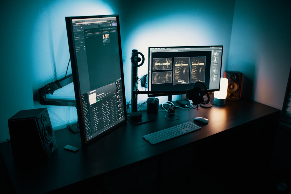 Dual-monitor desktop workstation in dark environment